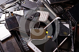 Telephones and smartphones of various types and generations not suitable for repair. Electronic scrap