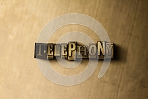 TELEPHONY - close-up of grungy vintage typeset word on metal backdrop