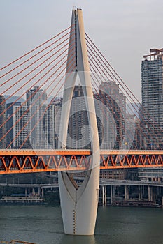 Telephoto view of Qian si men suspension bridge over Jialing river in Chongqing, southwest China