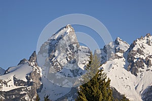 Telephoto view of snow-capped Grand Teton peaks