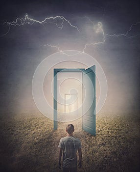 Teleportation doors concept. Rear view of a person standing in front of a doorway in the land, as seen in the mirror like a portal photo