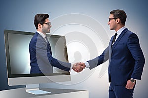 The telepresence concept with two businessman handshaking