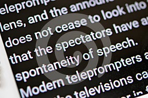 Teleprompter automatically scrolls text close-up.