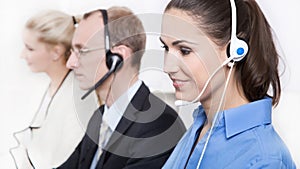 Telesales or helpdesk team with Headsets - workers at call Center. photo