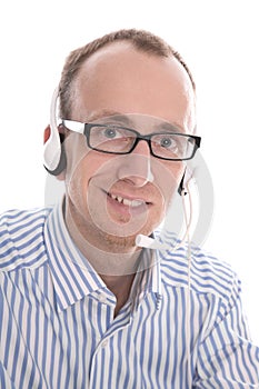 Telesales - Portrait of helpful man with headset smiling at came photo