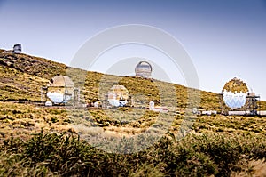 Telescope array. Nightsky observatory. Large mirror telescope. MAGIC observatory. Gran telescopio Canarias. Telescopes on a photo