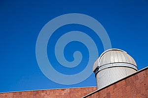 Telescope on a blue sky