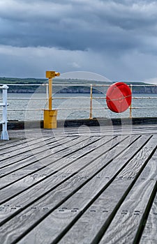 Telescope and life preserver at West Pier, Whitby, North Yorkshire. England.