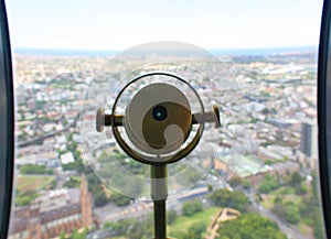 Telescope over a coastal city on a sunny day.