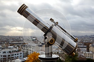 Telescope overlooking Paris. Cloudy sky