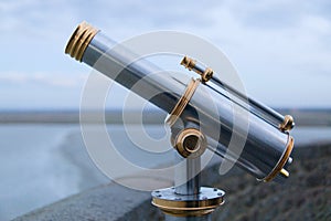 Telescope tower viewer chrome gold mont saint michel france tourism ocean