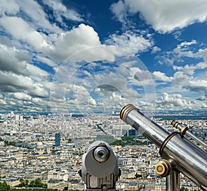 Telescope viewer and city skyline at daytime (against the background of very beautiful clouds). Paris, France.