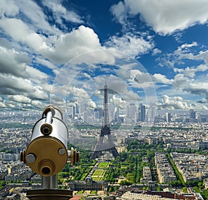 Telescope viewer and city skyline at daytime (against the background of very beautiful clouds). Paris, France