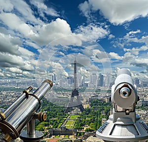 Telescope viewer and city skyline at daytime (against the background of very beautiful clouds). Paris, France