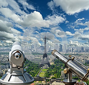 Telescope viewer and city skyline at daytime (against the background of very beautiful clouds). Paris, France