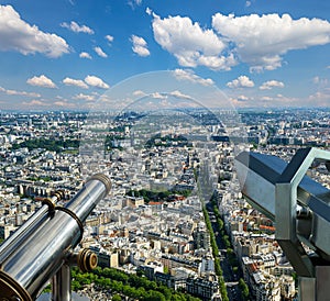 Telescope viewer and city skyline at daytime (against the background of very beautiful clouds). Paris, France