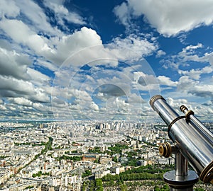 Telescope viewer and city skyline at daytime (against the background of very beautiful clouds). Paris, France