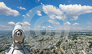 Telescope viewer and city skyline at daytime (against the background of very beautiful clouds). Paris, France