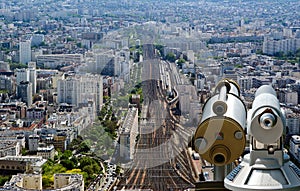 Telescope viewer and city skyline at daytime. Paris, France