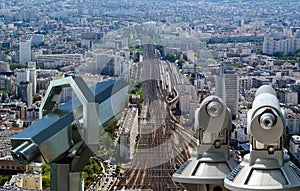 Telescope viewer and city skyline at daytime. Paris, France