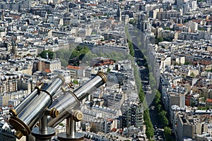 Telescope viewer and city skyline at daytime. Paris, France