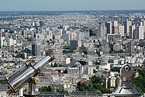 Telescope viewer and city skyline at daytime. Paris, France.