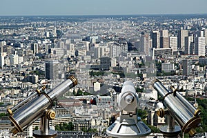 Telescope viewer and city skyline at daytime. Paris, France.