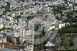 Telescope viewer and city skyline at daytime. Paris, France.