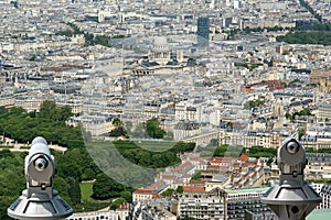 Telescope viewer and city skyline at daytime. Paris, France.