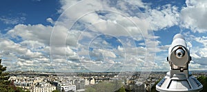 Telescope viewer and Paris skyline, France