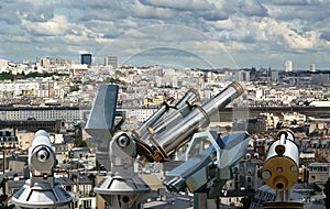 Telescope viewer and Paris skyline, France