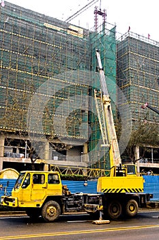 Telescopic crane are lifting heavy weight. photo