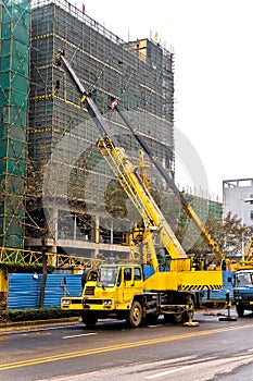 Telescopic cranes are lifting heavy weight. photo