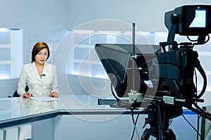 Television anchorwoman during live broadcasting photo