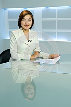 Television anchorwoman at TV studio