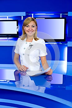 Television anchorwoman at TV studio photo