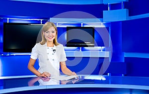 Television anchorwoman at TV studio photo