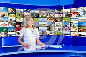 Television anchorwoman at TV studio photo