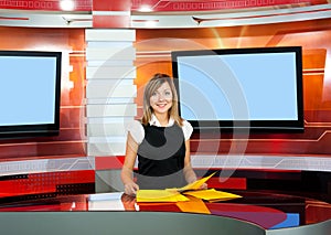 Television anchorwoman at TV studio photo