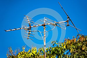 Television antenna on blue sky