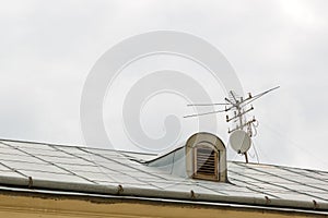 Television antenna over the roof of the old house