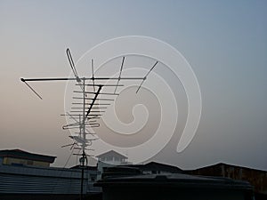 Television antenna on roof top of house