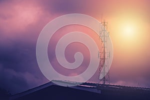 Television antenna with sunlight background.