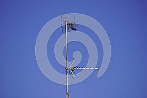 Television antenna under the blue sky
