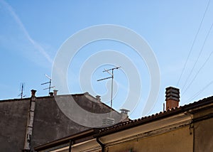 Television antennas with the old roofs view