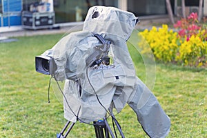 Television broadcast camera setup on a tripod and protected