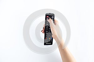 Television controller in woman hand