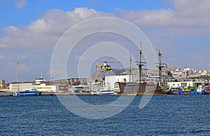 Television Film Crew In Helicopter Over Old Wooden Ship