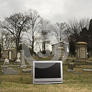 Television in graveyard.