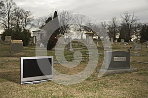 Television in graveyard.